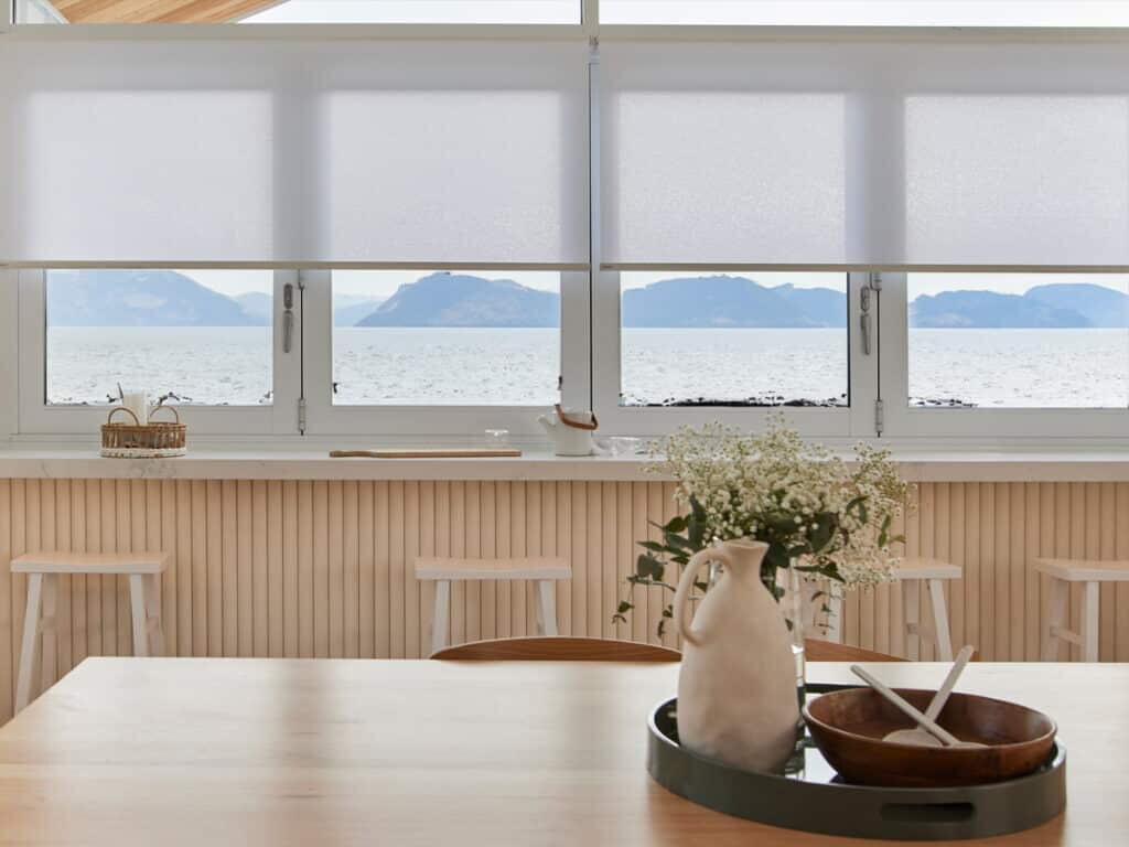 Coastal Roller Shades: Manage Sun, Glare, and Fading in Beach Homes