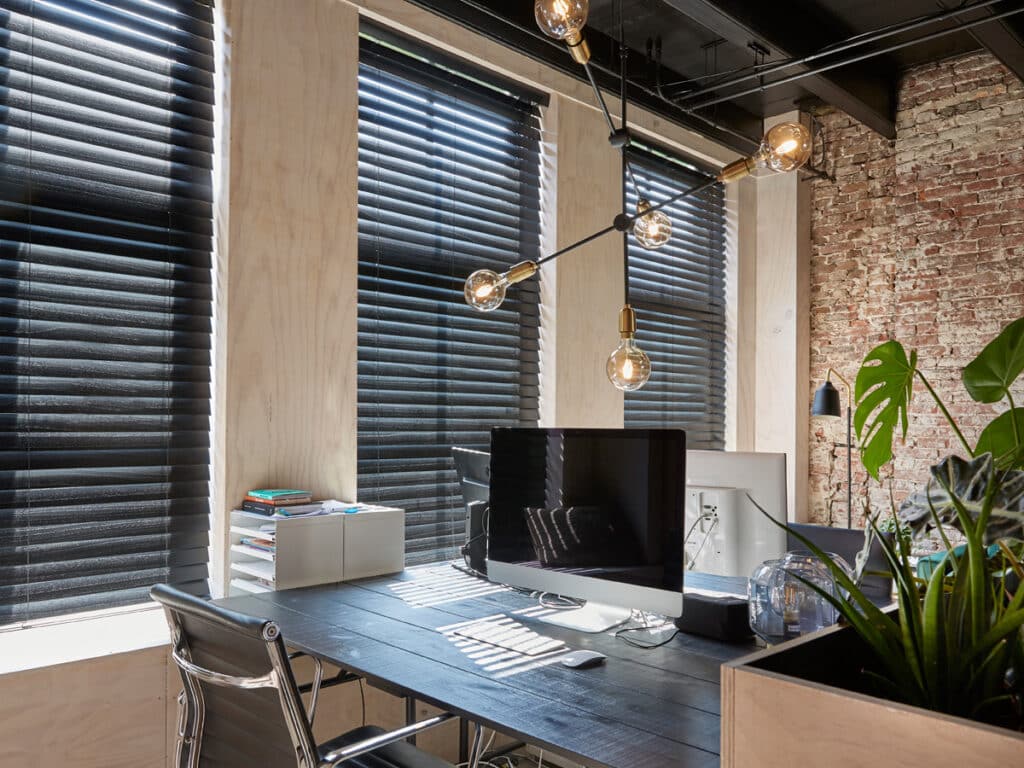 Industrial Loft Roller Shades: Balancing Concrete, Steel, and Daylight